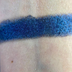 Helpless Eye Shadow Palette featuring 12 matte and shimmer shades in warm neutrals and bold jewel tones