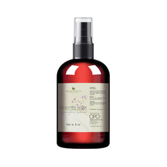 Toner bottle with dark red glass, black cap, and clear sprayer, by OPO