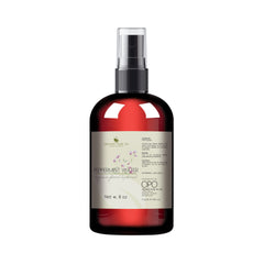 Toner bottle with red glass, black sprayer, and white label showing brand name