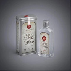 Perfume bottle and tin set with silver metal, clear glass, and Atelier Rebul label