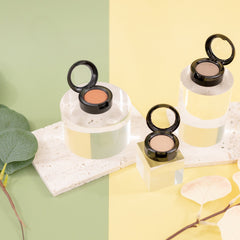 Close-up of sheer sequin orange Sunset Peach eyeshadow with shimmering mineral texture in compact pan