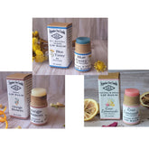 Lip balm trio with cardboard tubes, blue, white, and pink balms, Superior Dry Goods branding