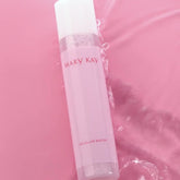 Micellar water bottle, pink and white plastic, Mary Kay branding, in water