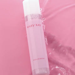 Micellar water bottle, pink and white plastic, Mary Kay branding, in water