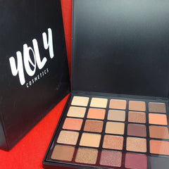 Side view of 25-color eyeshadow palette showing rectangular pans with matte and shimmer finishes in warm tones