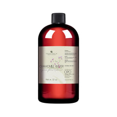 Chamomile water bottle with red liquid, black cap, and white label with text for external use