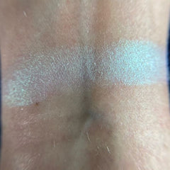 Close-up of Stardust Eye Shadow Palette showing shimmering bronze and gold shades with smooth, blendable texture