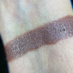 Side view of Wilted Eye Shadow Palette showcasing matte and shimmer pans in warm earthy tones with embossed logo