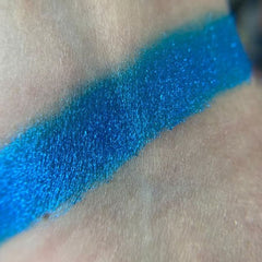 Close-up of Luna Eye Shadow palette showing shimmering taupe and soft pink powder textures in rectangular pans