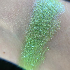 Side view of Globetrotter Eye Shadow Palette showcasing 12 vibrant matte and shimmer shades in circular pans