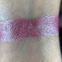 Close-up of vibrant pink and gold shimmer eyeshadows in Razzmatazz palette with smooth powder texture