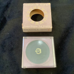 Cream powder eye shadow in pale pink and green compact with INNOXA branding and box