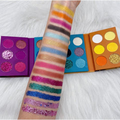 Front view of Face Me Eye Shadow Palette showcasing 12 vibrant matte and shimmer shades in a sleek black compact.