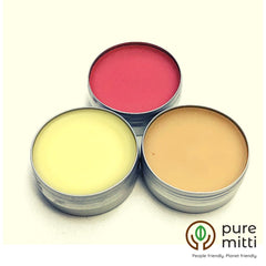 Lip balm trio in silver tins, with red, yellow, and beige colored balm, pure mitti brand
