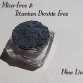 Eyeshadow powder dark gray matte pigment in clear jar, Nine Lives brand