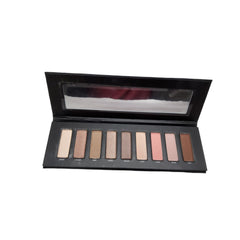 Close-up of nine vibrant eyeshadow shades in matte and shimmer finishes, arranged in a sleek black palette