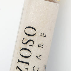 Bath salts in clear bottle with beige granules and black ZIO CARE text