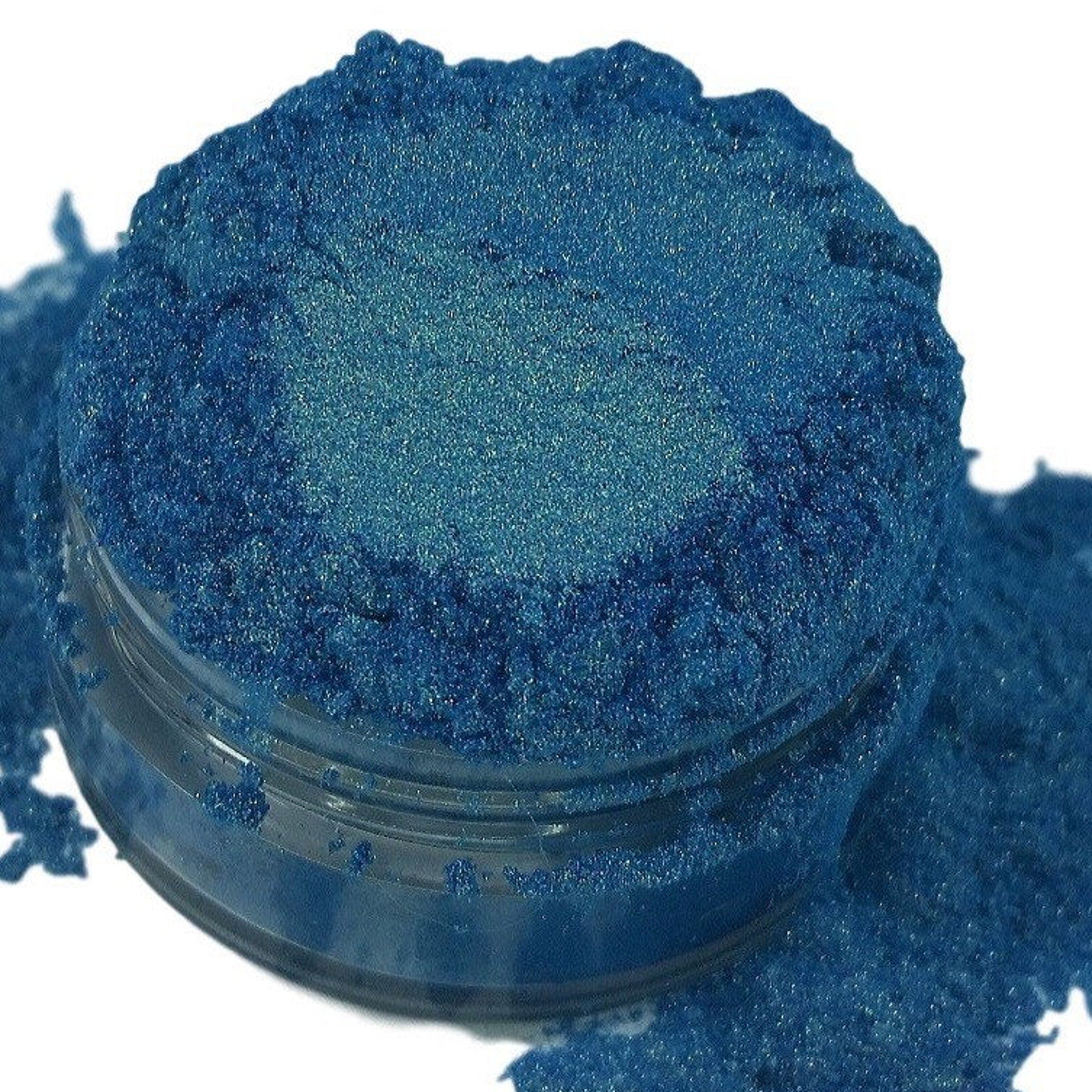 Eyeshadow powder, metallic blue, iridescent finish, in a clear jar