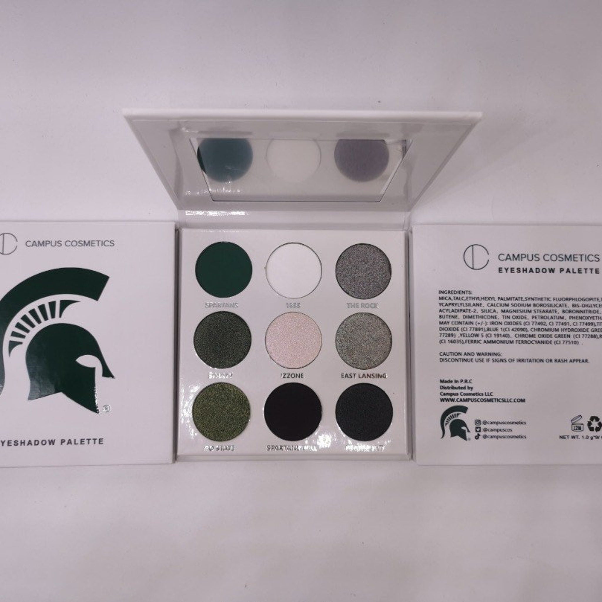 Green and white Michigan State University eye shadow palette with team logo, matte finish, in compact case