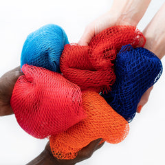 African net sponges in red, blue, and orange mesh, held by hands