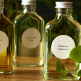 Reed diffuser refill bottles, clear glass, silver cap, with labels