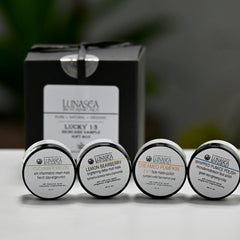 Face mask jars with black lids, white labels, and LunaSea Botanicals branding, in a gift set box