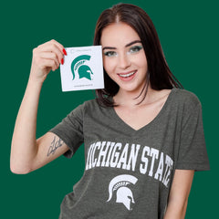 Close-up of Michigan State University green and white pressed powder eyeshadow with shimmer finish in compact case