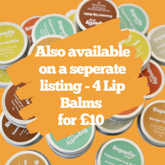 Lip balms in various colors and round metal tins, Superfly Soap branding visible on labels