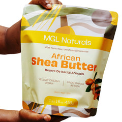 African Shea Butter bag with yellow and cream colors, MGL Naturals branding, held by hands.