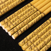 Hopi ear candles, beige cylindrical candles with brown text, Herbacon brand visible