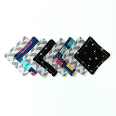 Coasters assorted colors and patterns, geometric and floral designs, square fabric
