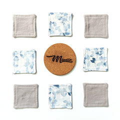 Reusable facial rounds in gray and blue floral pattern, with cork coaster and "Minessa" text