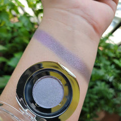 Eyeshadow swatch with lavender color and metallic finish, applied on skin