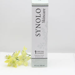 Facial Cleanser white rectangular box with Synolo Skincare text and floral pattern, with yellow flowers