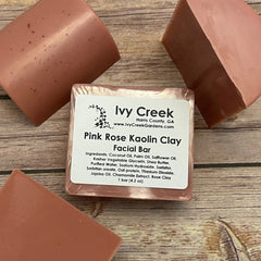 Pink Rose Kaolin Clay Facial Bar in pink, rectangular shape with visible Ivy Creek label on wood surface