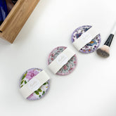 Washable cotton rounds with floral patterns, KOKO brand, white paper wrap on white surface