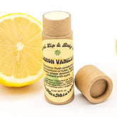 Lip balm tube, brown cardboard, yellow label with text, lemon slice visible