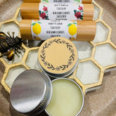 Lip balms with wooden tubes and metal tins, New Dawn Elements branding visible