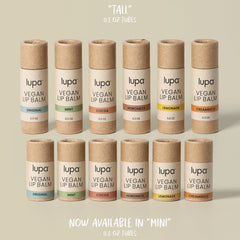 Vegan lip balm tubes in beige and brown cardboard with Lupa brand text and color labels
