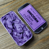 Unicorn-inspired eye shadow palette with pastel pink, purple, and blue shades in a holographic compact