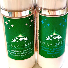 Facial cleanser bottles with green labels, white text, and Truly Green branding