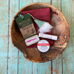 Lip care gift set with red burlap bag, green gnome, and Crystal Lake Soap Co. branding