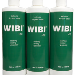 Three white plastic bottles of Wibi Extreme Dry Skin Lotion with blue caps and minimalist labeling, 16oz each
