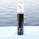 Facial cleanser bottle, black and silver, clear pump top, Synolo Menceutical brand