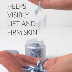 Capsule serum in hand, blue oval capsules, clear bottle with Nu Skin logo and text