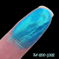 Close-up of Faboolous Duochrome Eyeshadow showing vibrant color shift from teal to purple shimmer