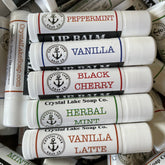 Lip balm tubes, white plastic, Crystal Lake Soap Co. branding, various flavor labels