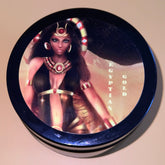 Minimalist white jar of whipped body butter with gold lid, creamy texture peeking through the opening