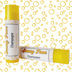 Lip balm tubes with yellow tops and white labels, "Saucy Face Champagne" text, on bubble pattern background.