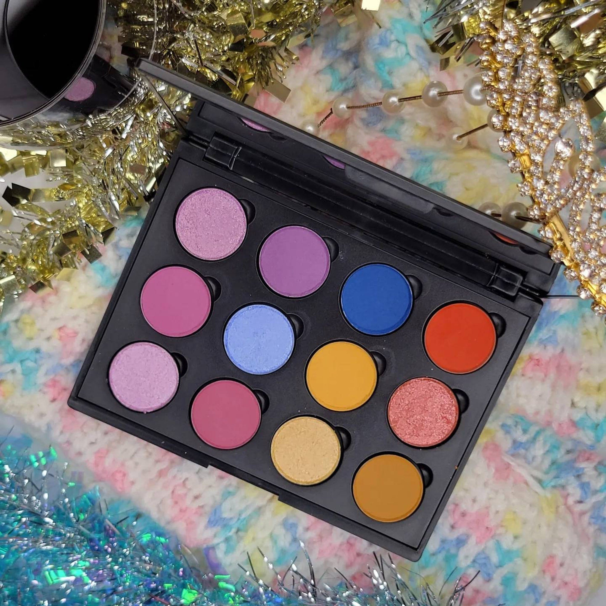 Eye makeup palette with multiple colors in a black case, colorful eyeshadows, Dandy Lions Cosmetics